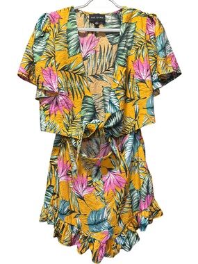 The Sang Tropical Print Tie Front Ruffle Bottom Romper
